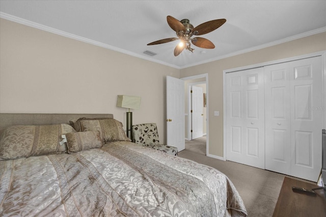 bedroom with crown molding, ceiling fan, a closet, and carpet floors