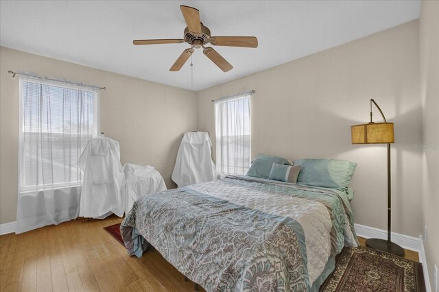 bedroom featuring hardwood / wood-style floors and ceiling fan