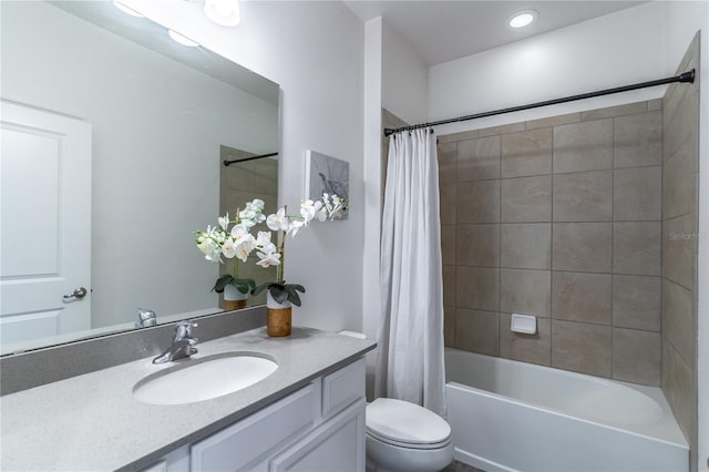 bathroom with vanity, toilet, and shower / tub combo with curtain