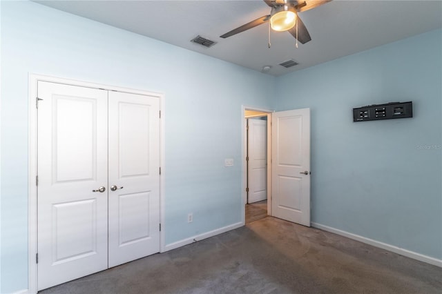 unfurnished bedroom with carpet flooring, visible vents, and baseboards