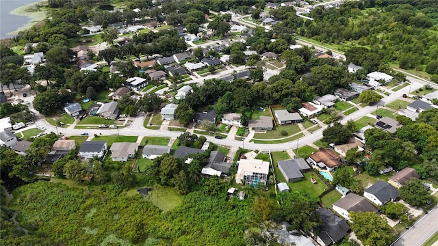 drone / aerial view featuring a residential view and a water view