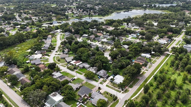 birds eye view of property featuring a residential view and a water view