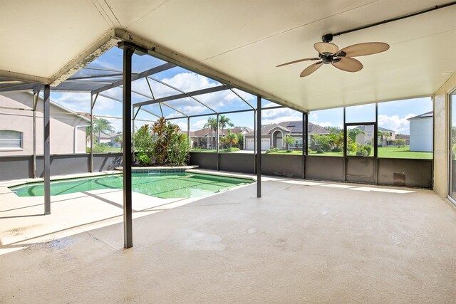 outdoor pool featuring a ceiling fan, a lanai, and a patio