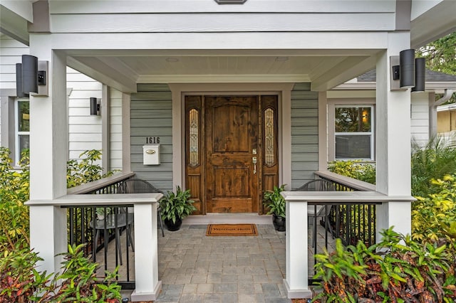 doorway to property with a porch