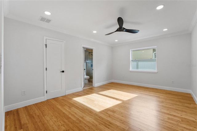 unfurnished room featuring ceiling fan, light hardwood / wood-style floors, and crown molding