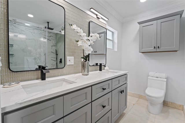 bathroom with a shower with door, vanity, tile patterned flooring, crown molding, and toilet