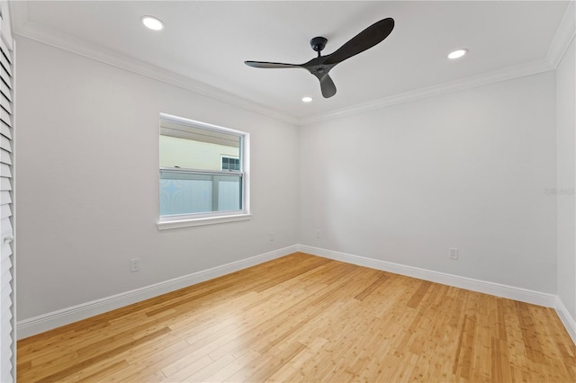 spare room with ceiling fan, ornamental molding, and light wood-type flooring