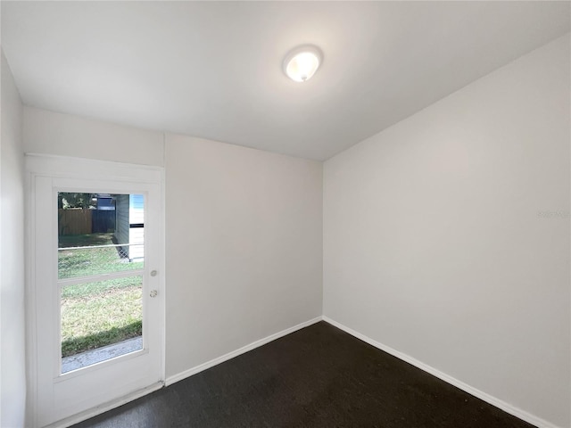 spare room featuring baseboards