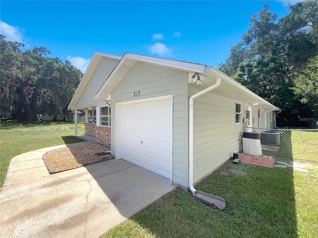 view of home's exterior featuring an attached garage, brick siding, fence, concrete driveway, and a lawn