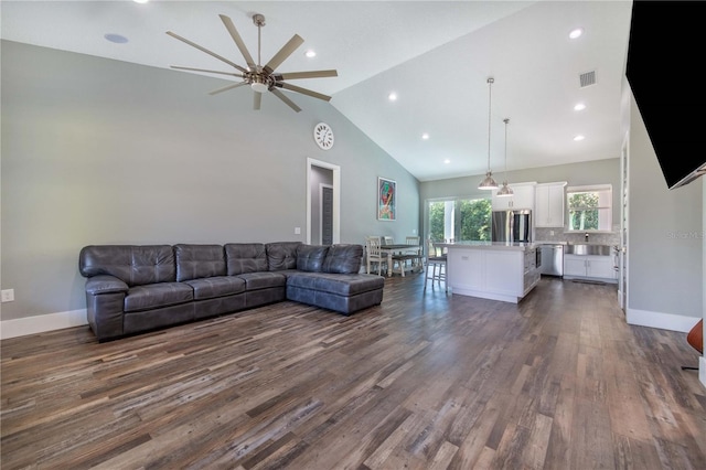 living room featuring sink, high vaulted ceiling, ceiling fan, and dark hardwood / wood-style floors