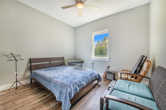 bedroom with ceiling fan and hardwood / wood-style floors