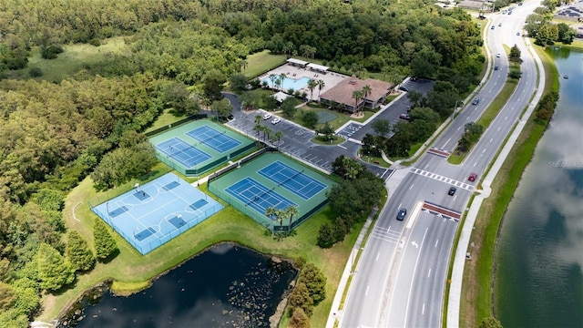 birds eye view of property with a water view