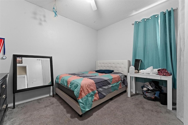 carpeted bedroom with a textured ceiling and ceiling fan