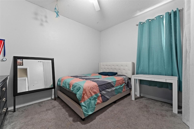 carpeted bedroom featuring a textured ceiling and ceiling fan