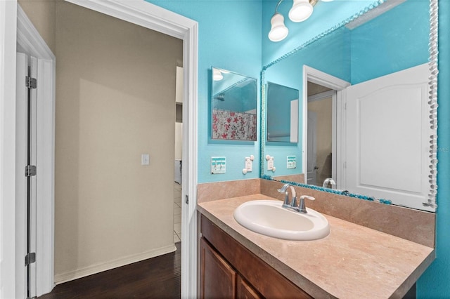 bathroom with wood-type flooring and vanity