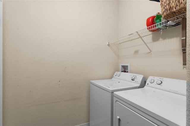 clothes washing area featuring washing machine and clothes dryer