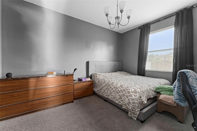 carpeted bedroom with a notable chandelier