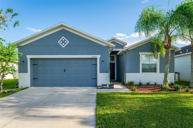 view of front of property featuring a garage and a front lawn