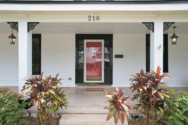 property entrance featuring covered porch