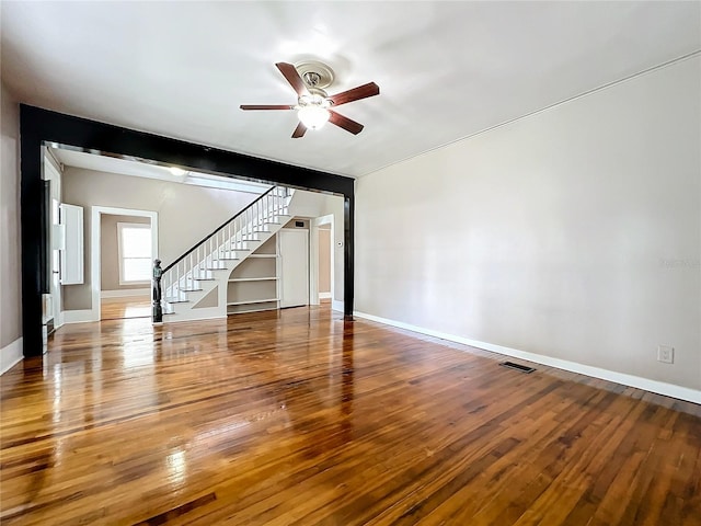 spare room featuring ceiling fan and hardwood / wood-style flooring