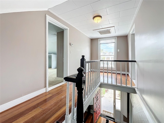 interior space featuring hardwood / wood-style flooring, plenty of natural light, and ornamental molding