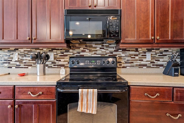 kitchen featuring black appliances and decorative backsplash