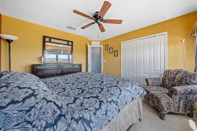 bedroom with carpet flooring, ceiling fan, and a closet