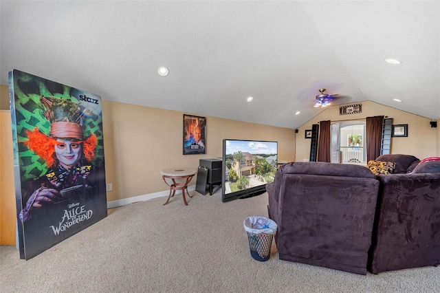 carpeted cinema room featuring vaulted ceiling and ceiling fan