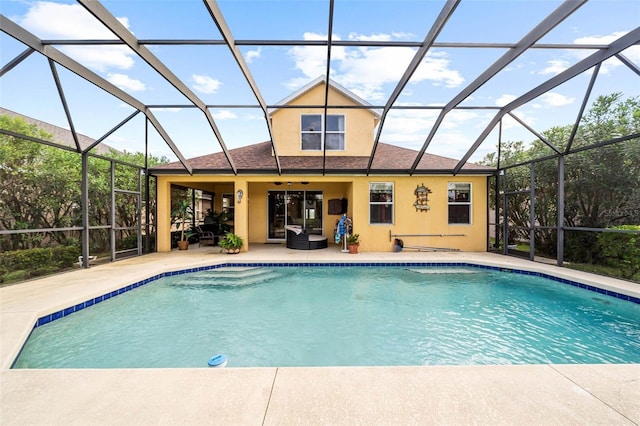 view of swimming pool featuring a lanai and a patio