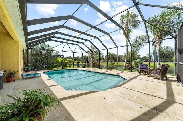 view of swimming pool featuring a lanai and a patio area