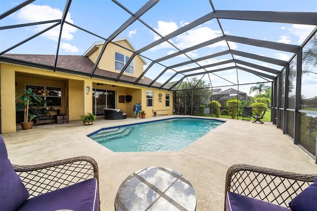 view of pool with a lanai and a patio area