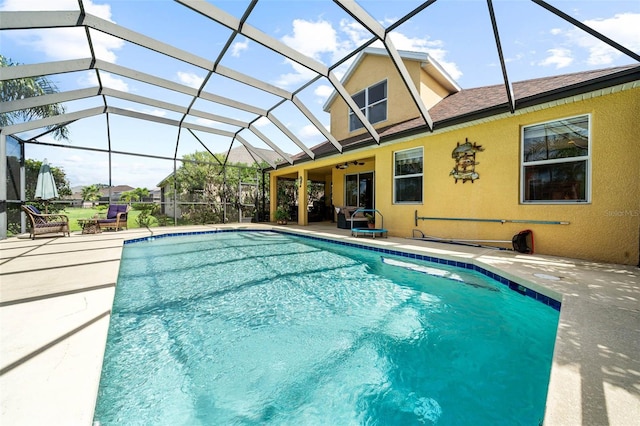 view of pool featuring a lanai and a patio