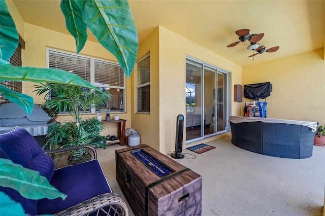 view of patio / terrace featuring ceiling fan