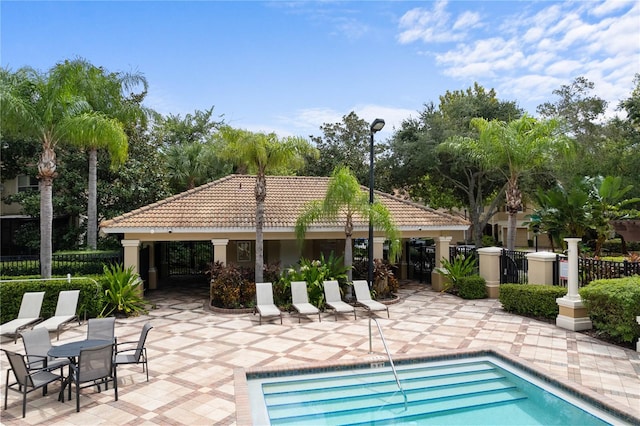 view of swimming pool with a patio area