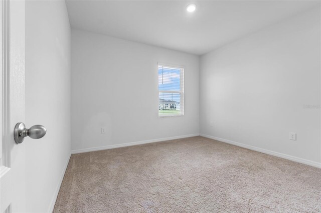 unfurnished room featuring carpet flooring