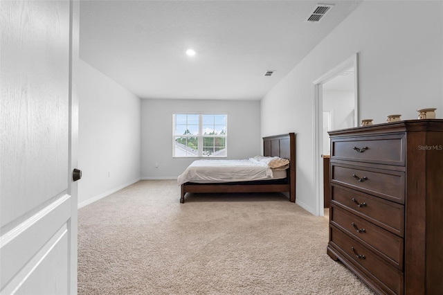 bedroom featuring light colored carpet