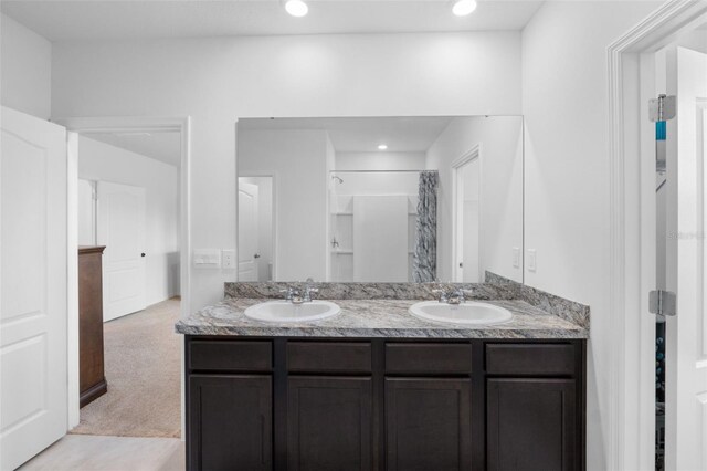 bathroom with vanity and a shower with curtain