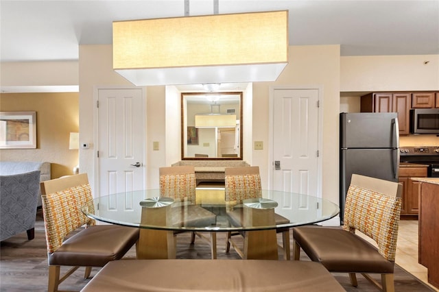 dining area featuring hardwood / wood-style floors