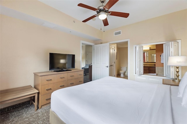 bedroom with ceiling fan and connected bathroom