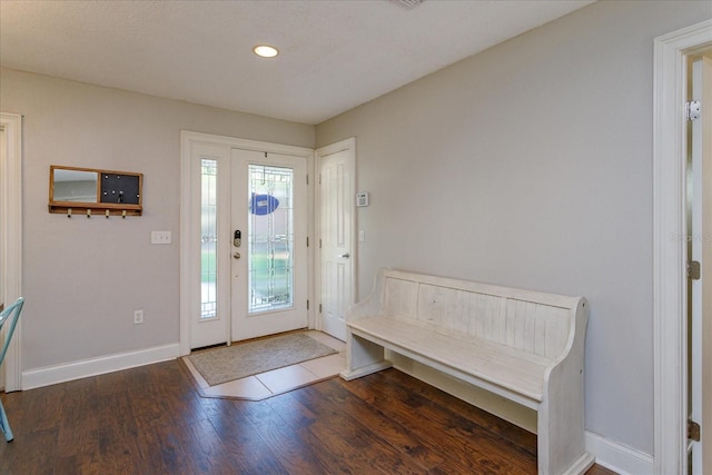 entryway with dark hardwood / wood-style floors