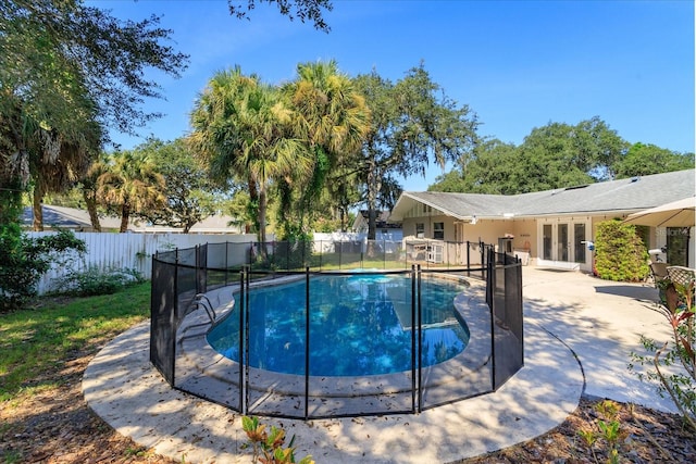 view of swimming pool featuring a patio