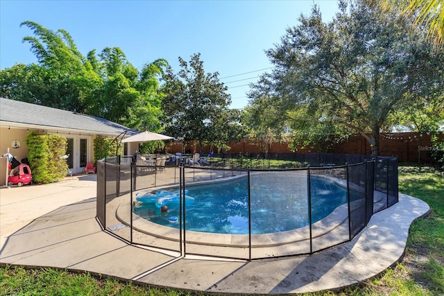 view of swimming pool with a patio area