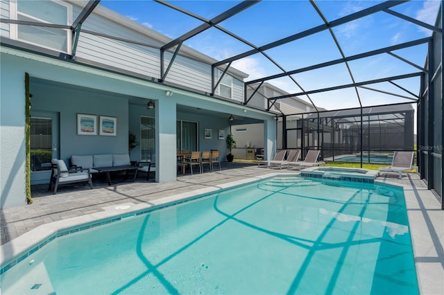 view of swimming pool featuring a patio, an in ground hot tub, outdoor lounge area, and glass enclosure