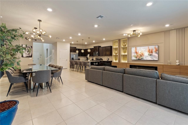 tiled living room with a chandelier