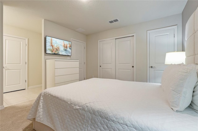 bedroom with light colored carpet