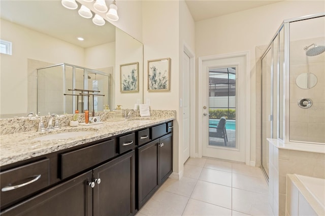 bathroom featuring vanity, tile patterned flooring, and an enclosed shower