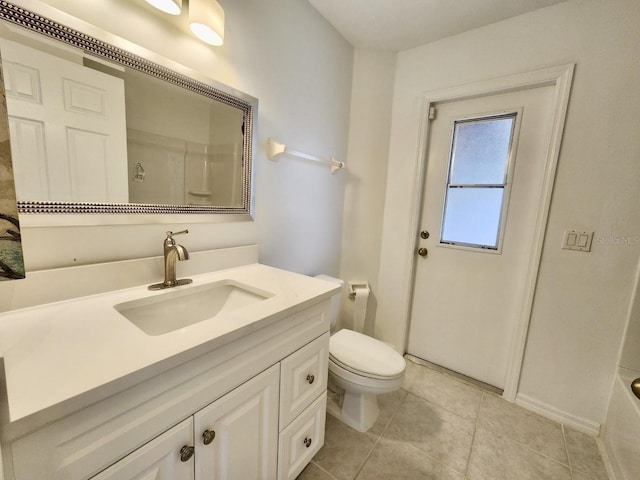 full bath with vanity, toilet, tile patterned flooring, and walk in shower