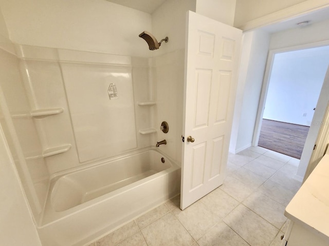 full bath with tile patterned floors, vanity, and shower / bathtub combination