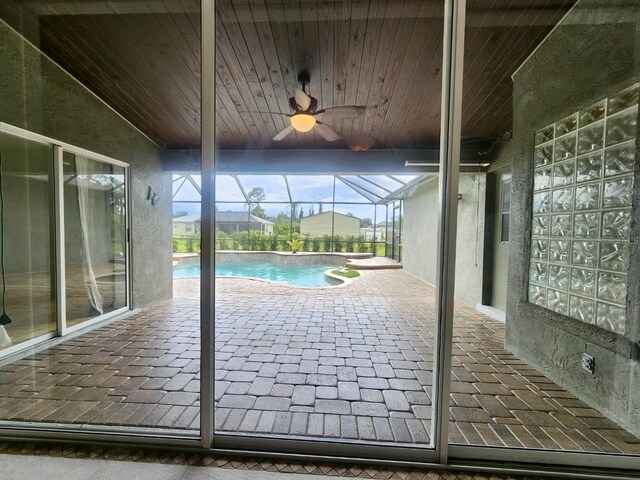 view of swimming pool featuring ceiling fan