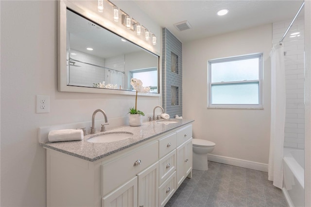 full bathroom featuring vanity, toilet, and shower / bathtub combination with curtain